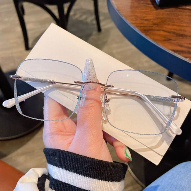 Women’s Frameless Myopia Glasses – Anti Blue Light Oval Lens with Metal Racket Frame | Stylish & Protective Eyewear