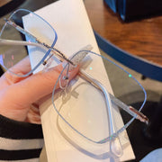 Women’s Frameless Myopia Glasses – Anti Blue Light Oval Lens with Metal Racket Frame | Stylish & Protective Eyewear