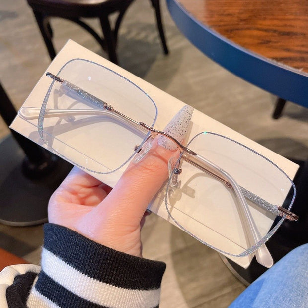 Women’s Frameless Myopia Glasses – Anti Blue Light Oval Lens with Metal Racket Frame | Stylish & Protective Eyewear