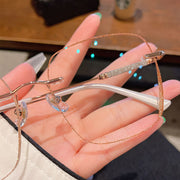 Women’s Frameless Myopia Glasses – Anti Blue Light Oval Lens with Metal Racket Frame | Stylish & Protective Eyewear